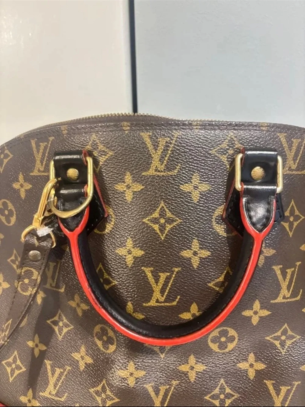 Louis Vuitton Monogram Alma Satchel in Brown with Red Trim